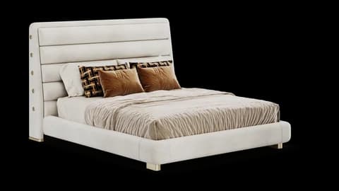 Cream upholstered bed with a horizontally channeled headboard and brass-tipped feet, three-quarter view