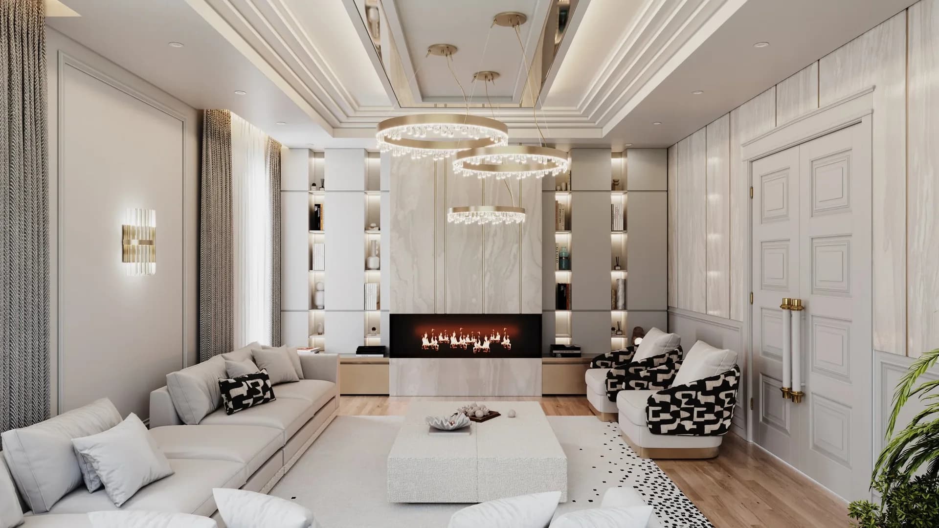 Pale modular sofa opposite black-and-white patterned armchairs, with a central fireplace and three ring pendant lights.