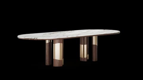 Marble dining table raised on clustered walnut cylinders banded in brushed brass