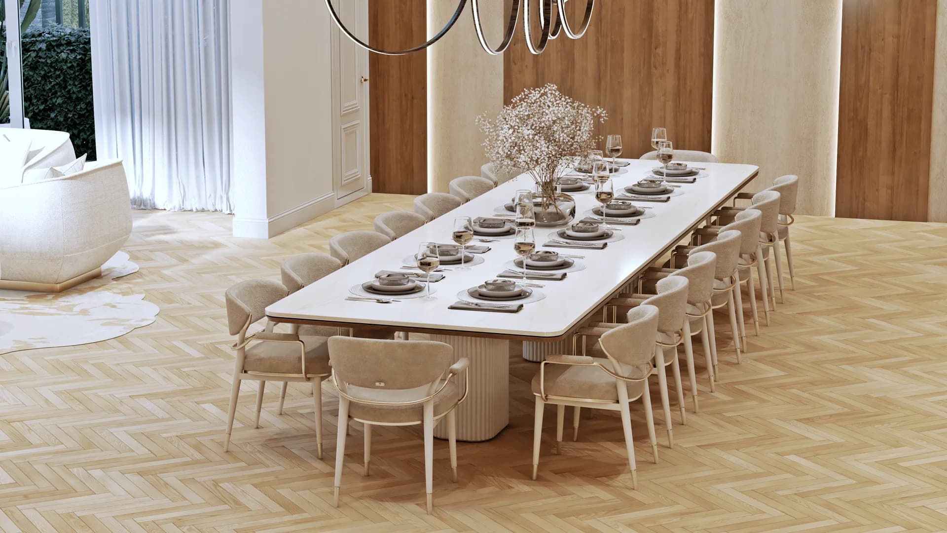 A long pale dining table with upholstered chairs and fluted supports on patterned wood parquet.